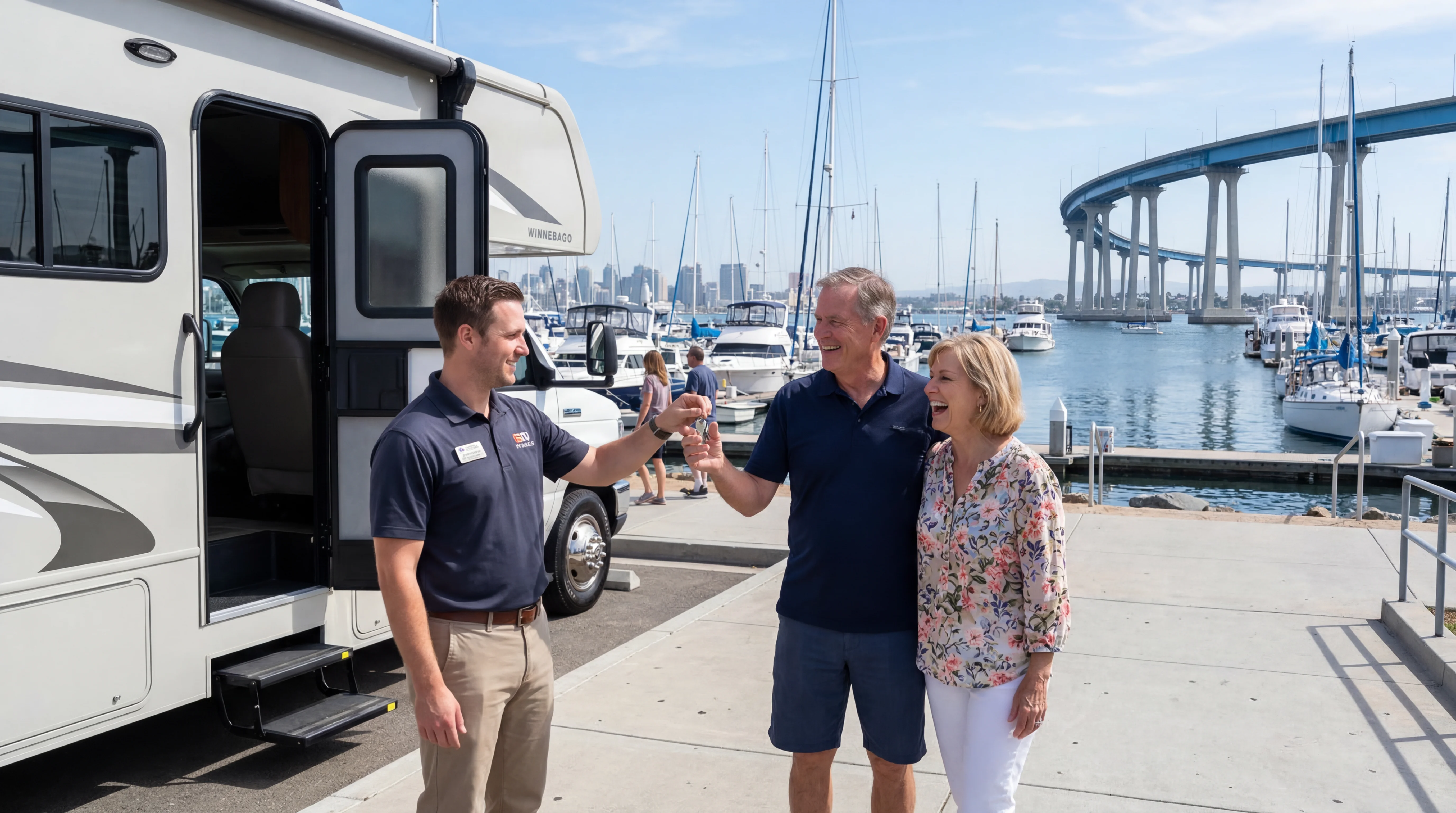 Couple receiving RV keys near San Diego harbor with Coronado Bridge